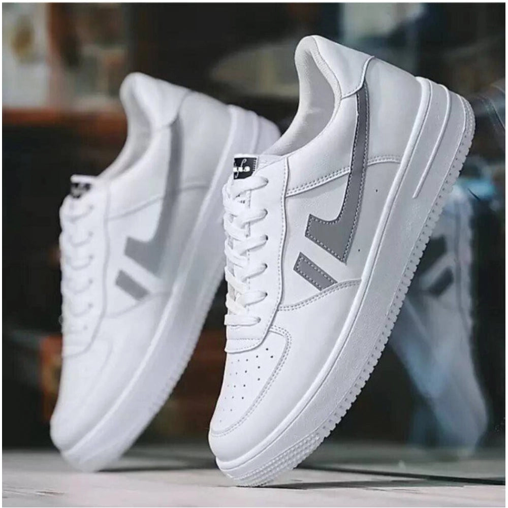 White sneakers with gray accents on a blurred background