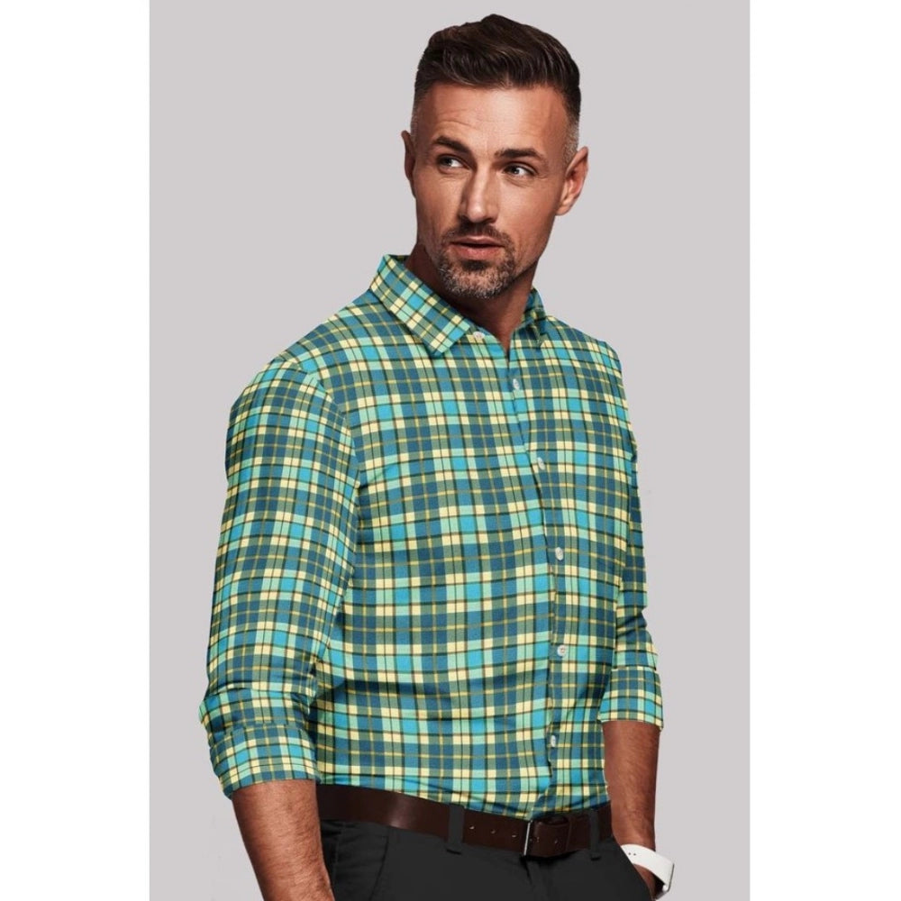Man wearing a green and blue plaid shirt against a gray background