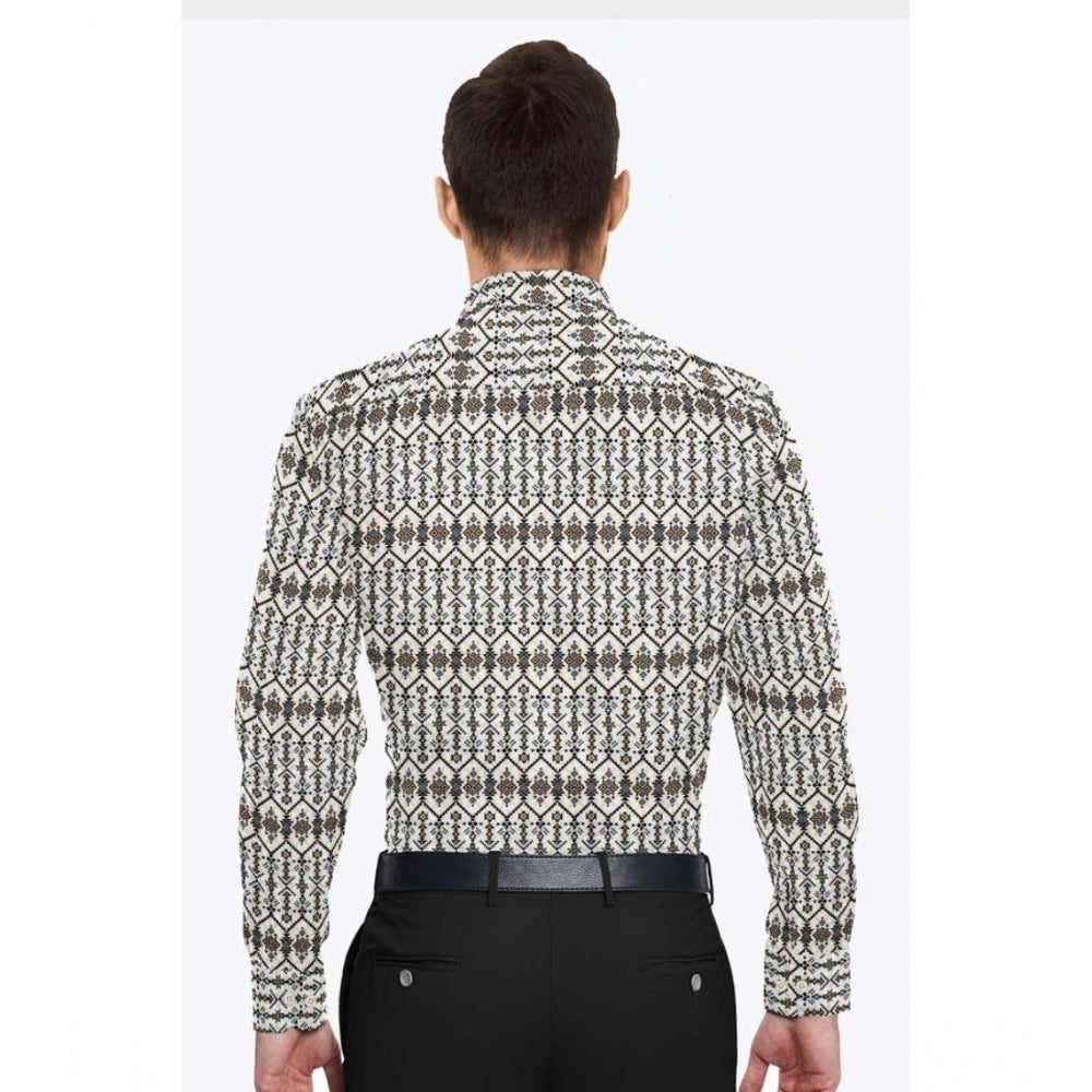 Man wearing a patterned shirt and black pants on a white background