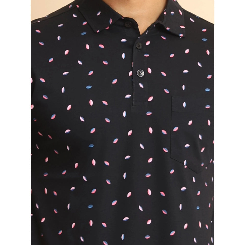 Black polo shirt with colorful pattern on a plain background
