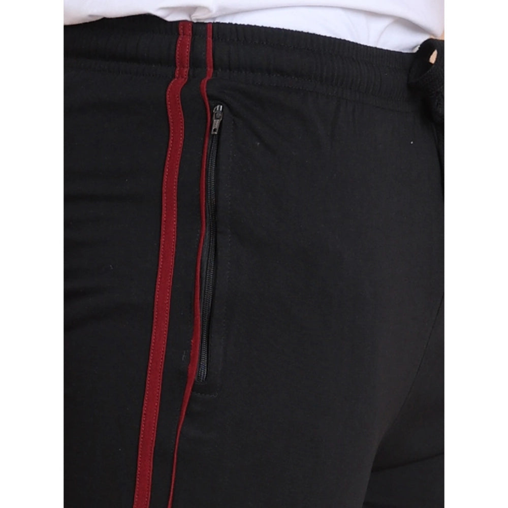 Black pants with red stripes and a zipper on a white background