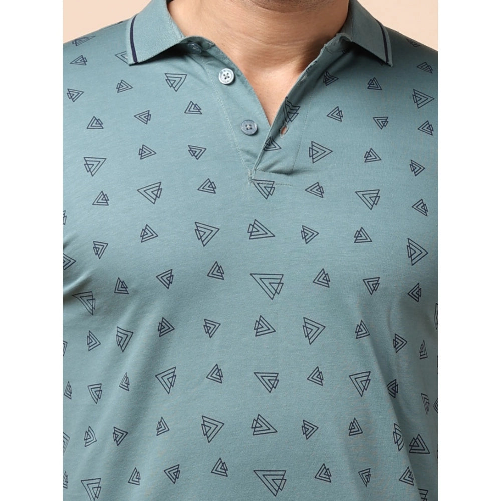 Green polo shirt with geometric pattern on a plain background