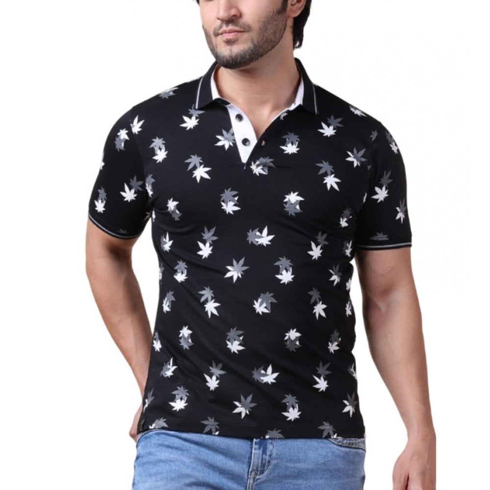 Man wearing a black polo shirt with white floral patterns on a white background