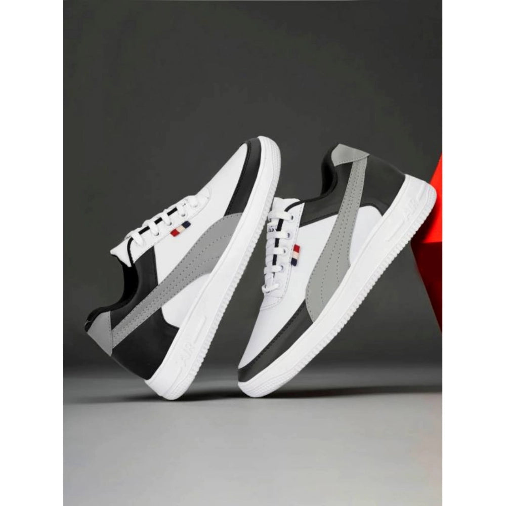 White sneakers with black accents on a dark background