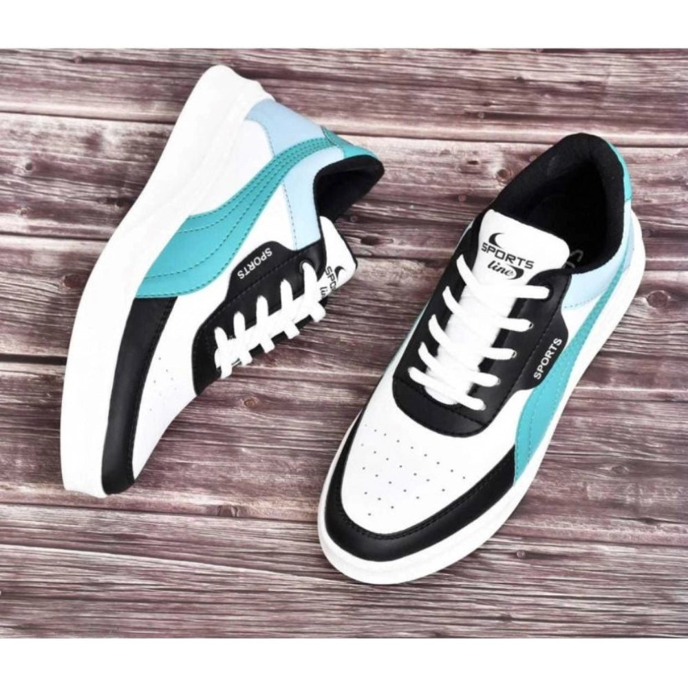 Pair of white sneakers with black and blue accents on a wooden surface