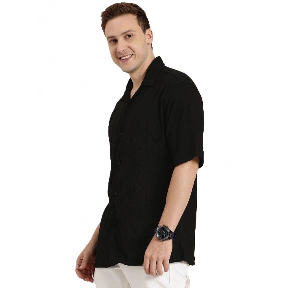 Man wearing a black polo shirt on a white background